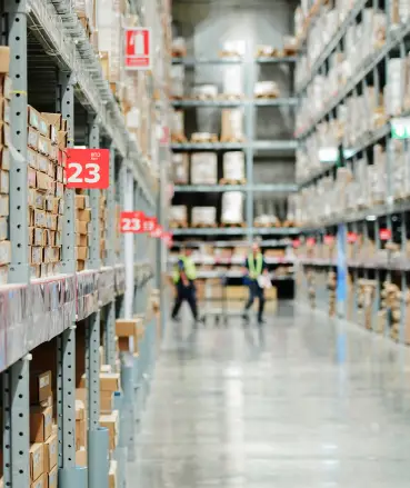 Large warehouse interior with numbered storage aisles and industrial shelving systems